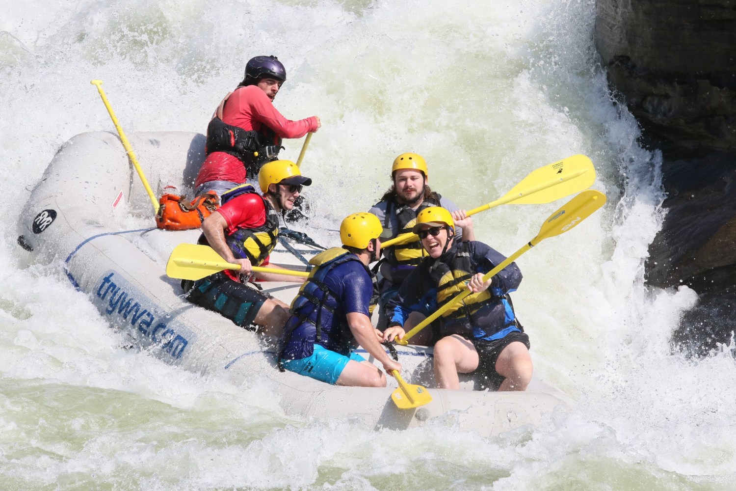 a man riding on a raft in a body of water